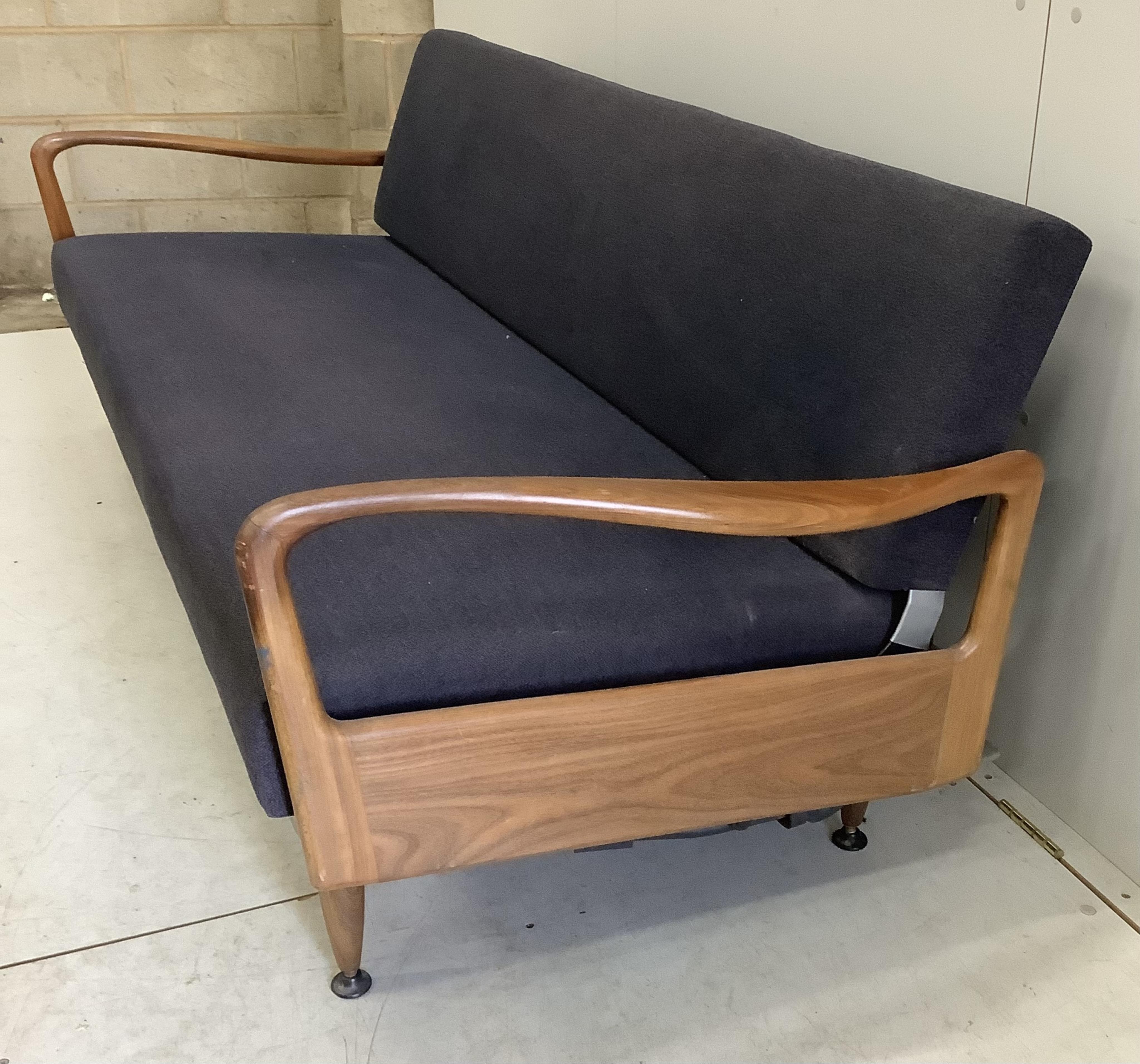 A mid century Greaves and Thomas teak sofa bed, width 200cm, depth 79cm, height 72cm. Condition - good